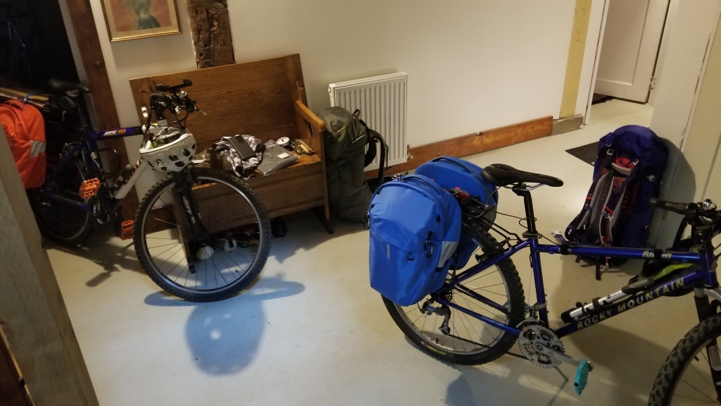 Photo of two bikes with paniers in the hallway